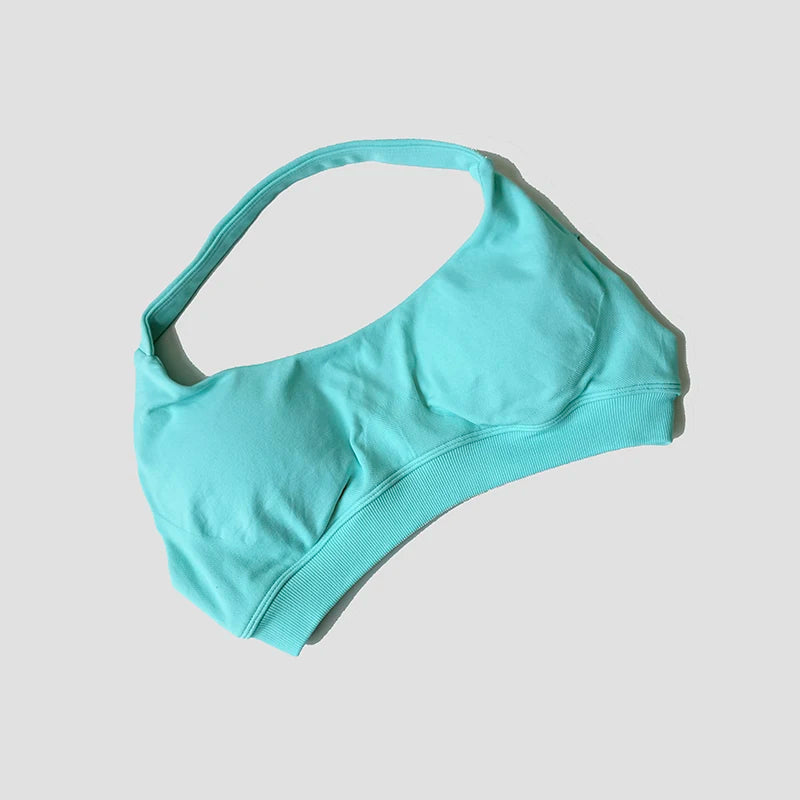 Sutiã esportivo sem costura com alças halter, top cropped sexy com bojo nas costas para yoga e academia.