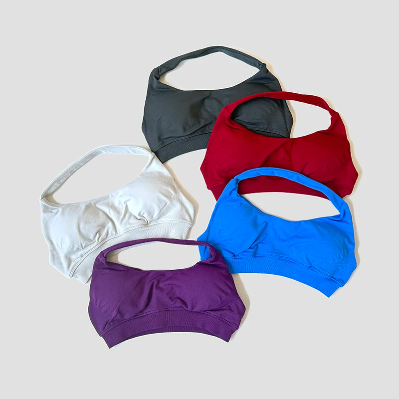 Sutiã esportivo sem costura com alças halter, top cropped sexy com bojo nas costas para yoga e academia.