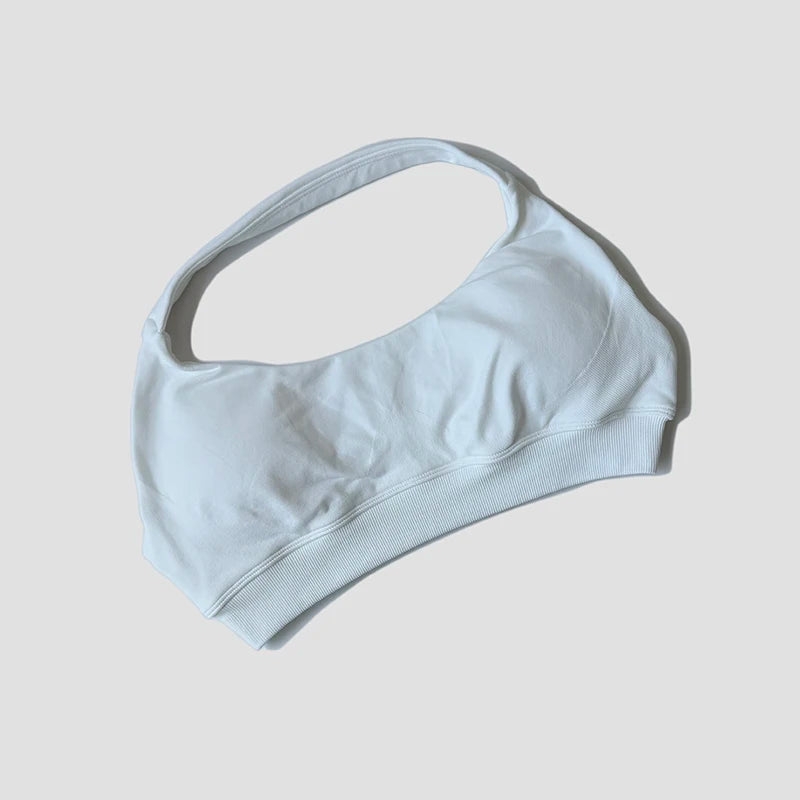 Sutiã esportivo sem costura com alças halter, top cropped sexy com bojo nas costas para yoga e academia.